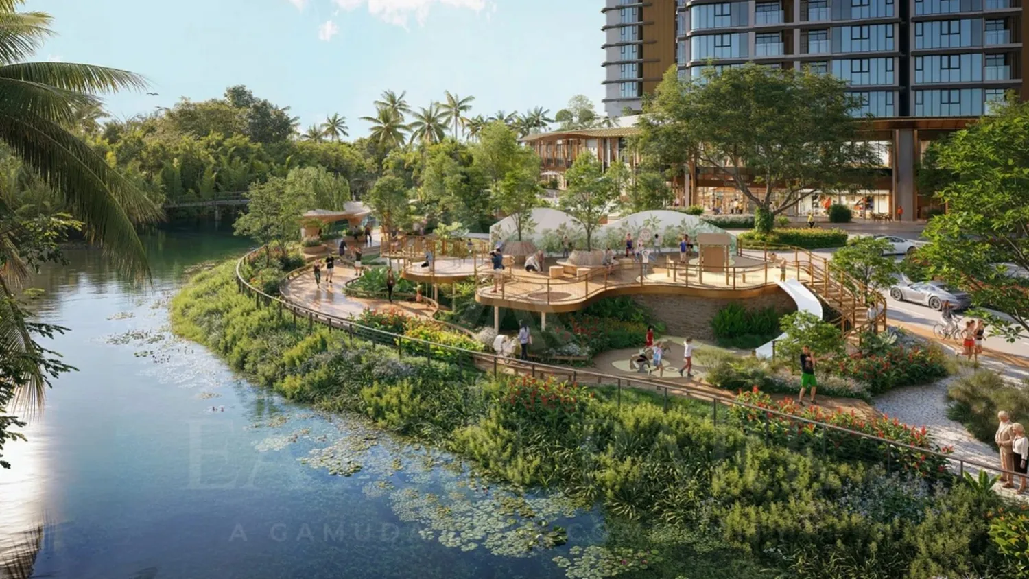 Đường dạo ven nước Eaton Park: lối đi dọc rạch Bà Dạt với các sàn vui chơi xen giữa mảng xanh.